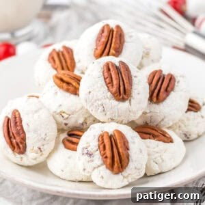Plate of classic divinity cookies topped with pecans.