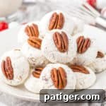 Plate of classic divinity cookies topped with pecans.