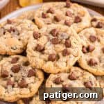 Plate filled with Ranger Cookies with cornflakes, chocolate chips, rice kripsies cereal, and oats, showcasing their delightful texture and ingredients.