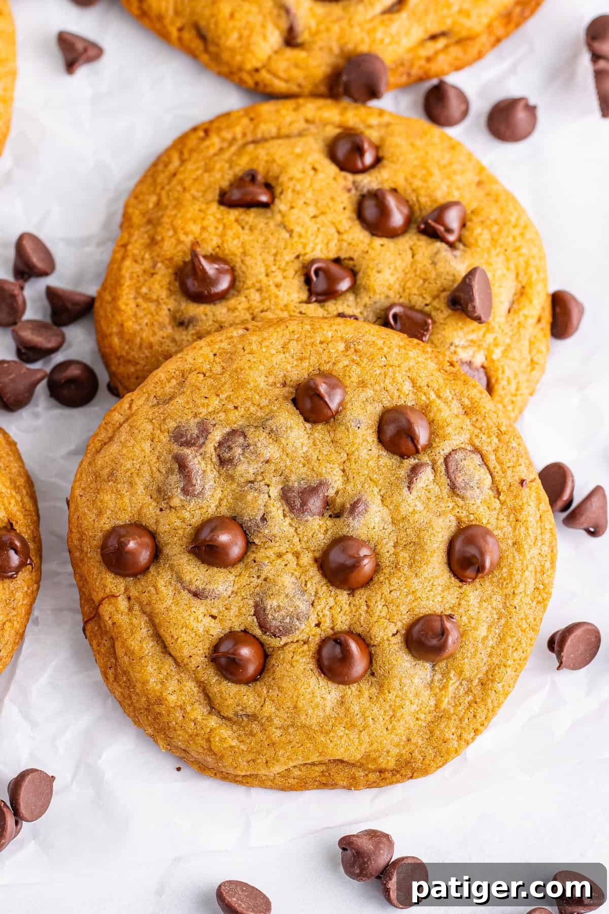 A close-up of freshly baked Mrs. Fields chocolate chip cookies, featuring golden-brown edges and gooey chocolate chips. Perfect for recreating the iconic Mrs. Fields chocolate chip cookie recipe at home.