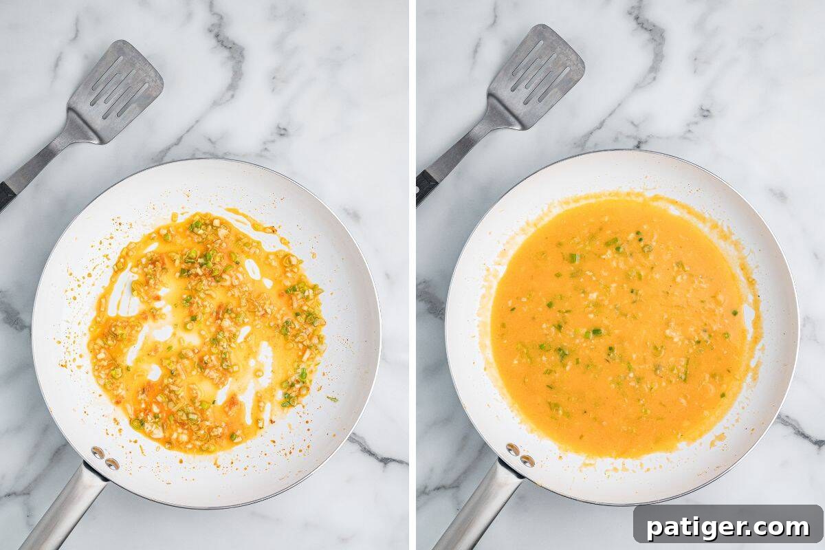 Loaded Cheesy Shrimp Grits 8 A pair of images showing a white skillet during the process of making sauce. The left image shows garlic and chopped scallions sautéing in orange-colored liquid, and the right image shows the mixture thickened into a more uniform orange sauce.