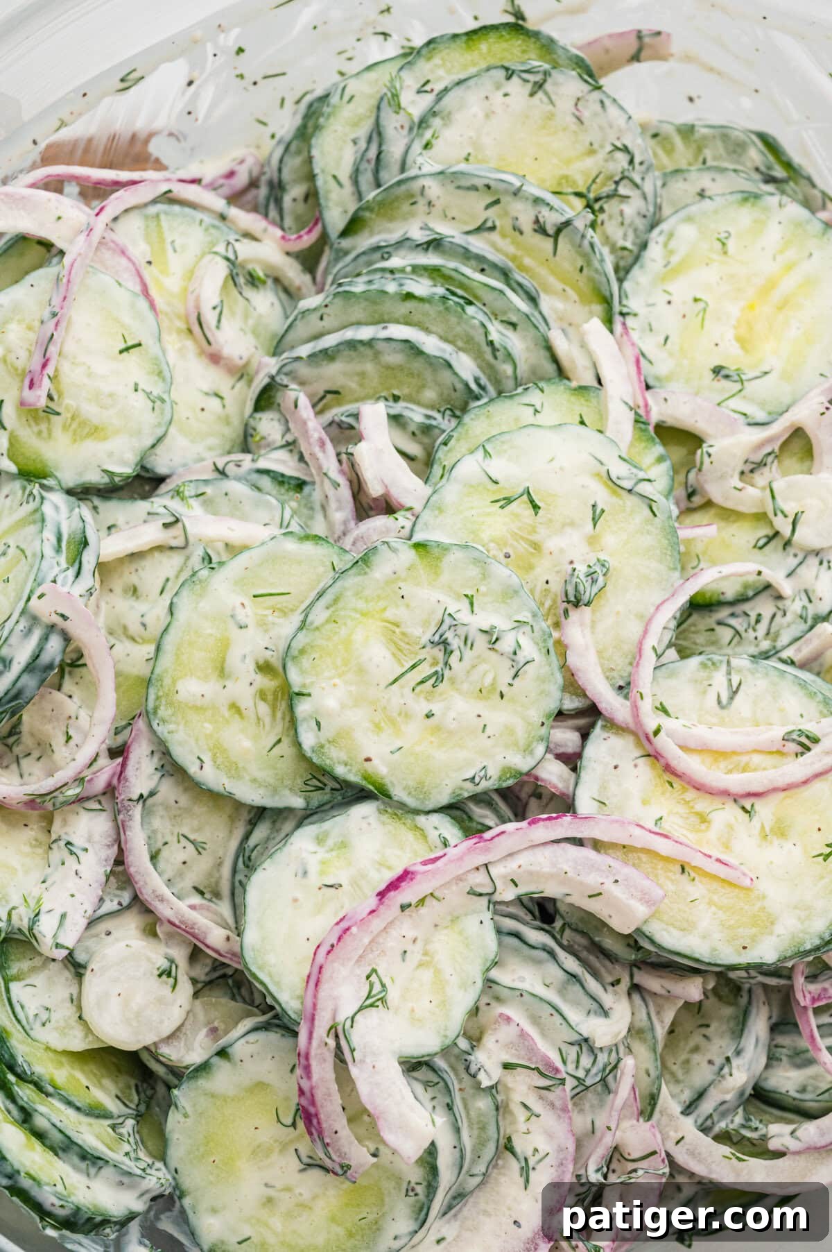 A creamy cucumber salad with sour cream, dill, and onion. 