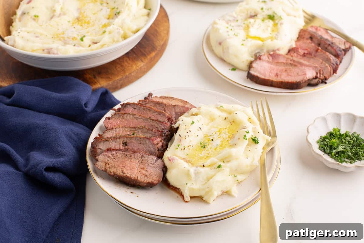 Rustic Red Potato Mash 6 Plate of red skinned mashed potatoes with sliced beef.