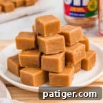 Stack of peanut butter fudge on a white plate.