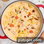 Crack Chicken Noodle Soup in a Dutch oven with a wooden ladle.