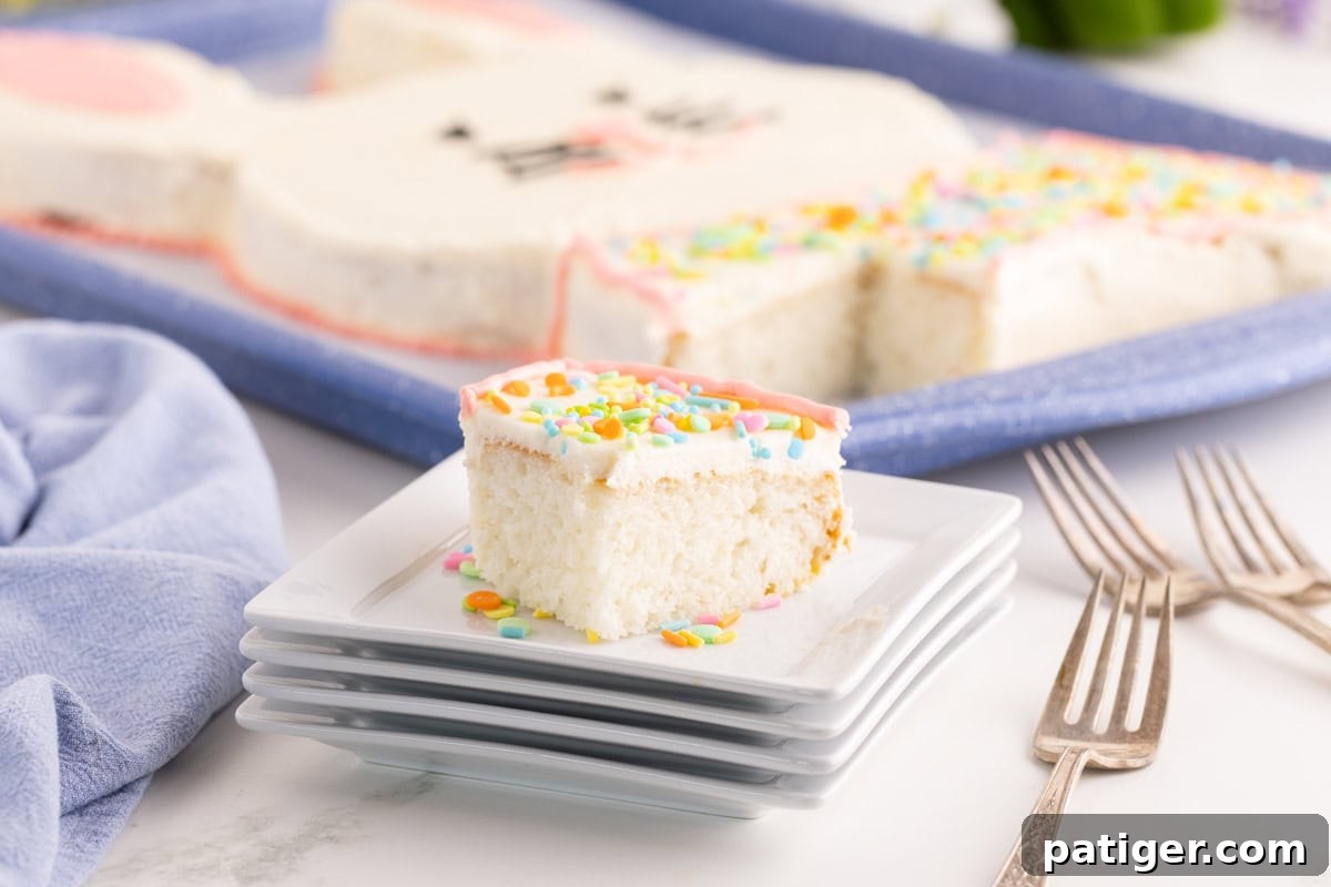 Charming Easter Bunny Cake 6 Slice of frosted Easter bunny cake on stacked white plates with sprinkles.