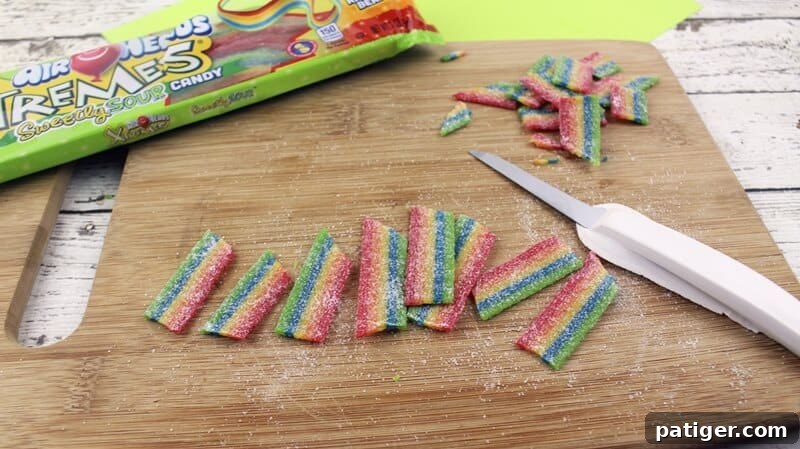 Chilled Airheads Xtremes rainbow candies cut into approximately 1-inch pieces, each featuring one straight and one angled end for decoration.