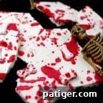 Blood splattered white chocolate bark with bone sprinkles.