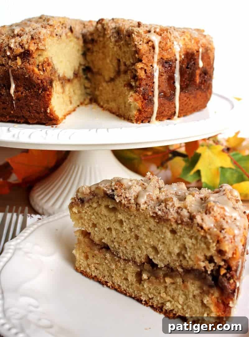 Maple Walnut Coffee Cake drizzled with maple icing, ready to be served.
