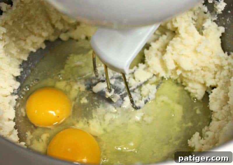 Butter and sugar being creamed in a large mixing bowl for the coffee cake batter.
