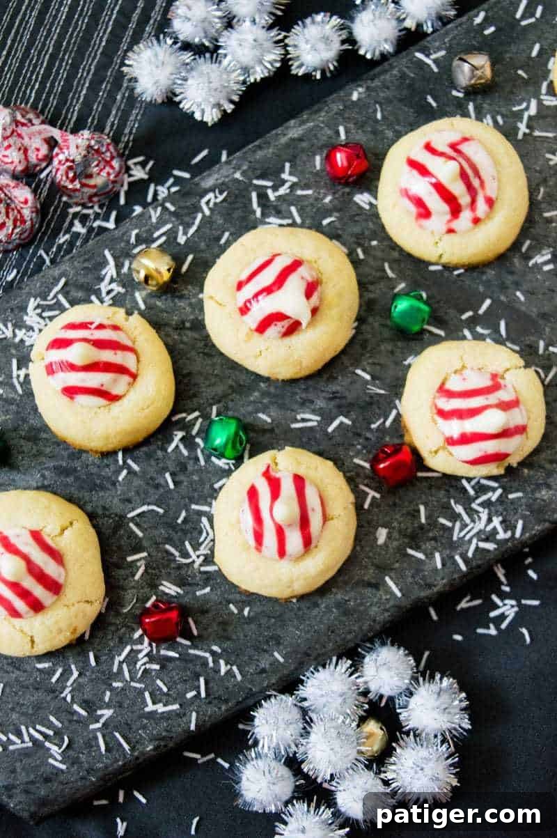 Festive Candy Cane Hershey Kiss Cookies with a delightful peppermint flavor, perfect for holiday gatherings and cookie exchanges.