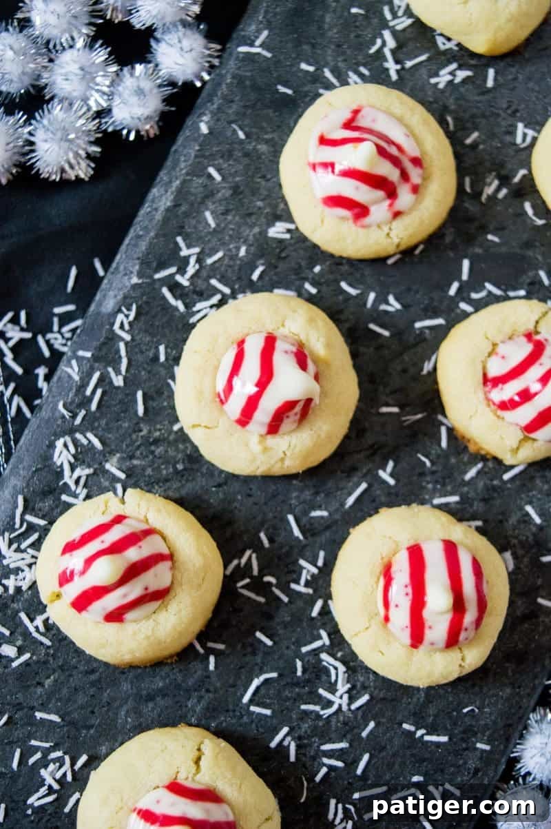 Peppermint Kiss Cookies beautifully arranged, highlighting their festive appearance and ideal for gifting or holiday buffets.