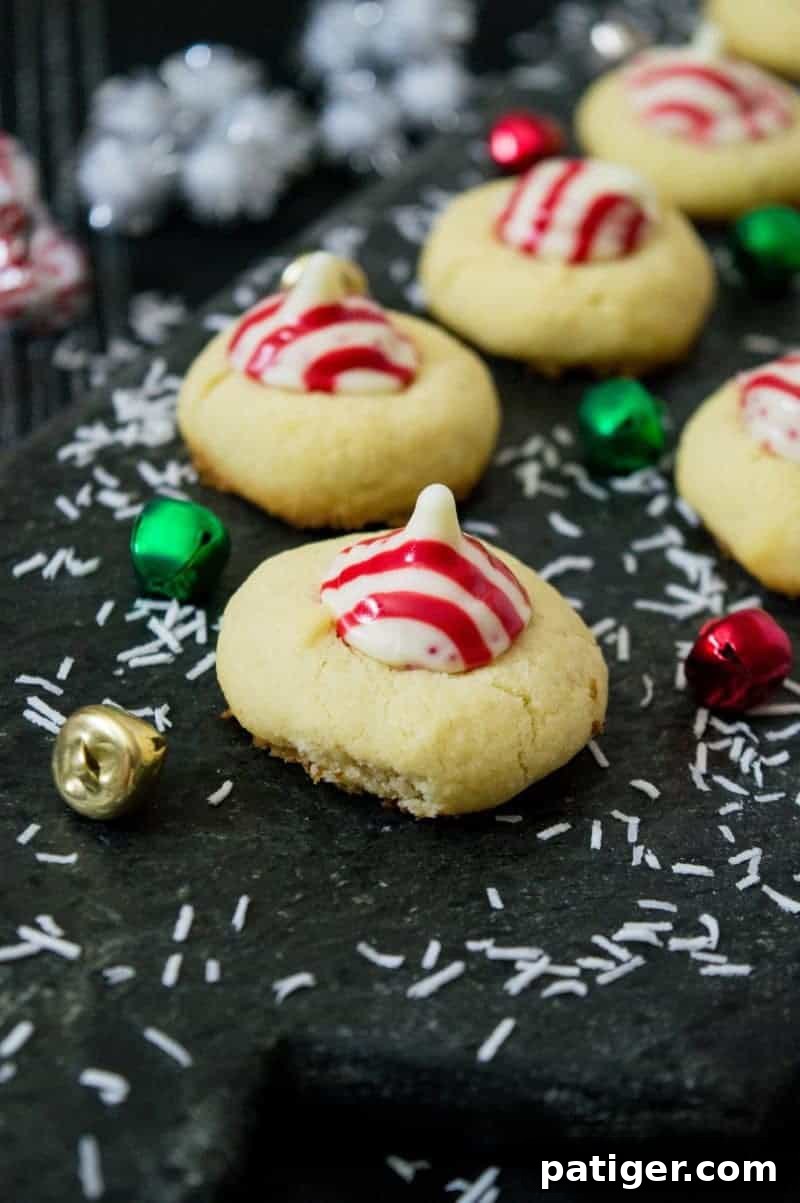 Christmas Candy Cane Hershey Kiss Cookies, a crowd-pleasing recipe for festive gatherings.