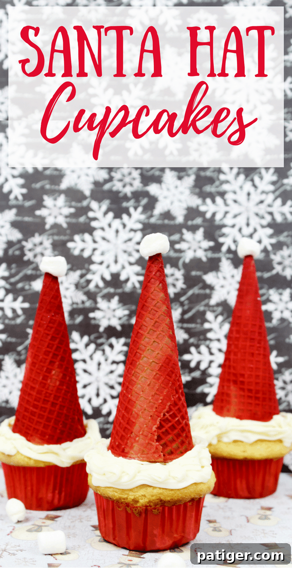 A close-up of a Santa Hat Cupcake, highlighting the detailed frosting and the crisp red sugar cone with a marshmallow top.