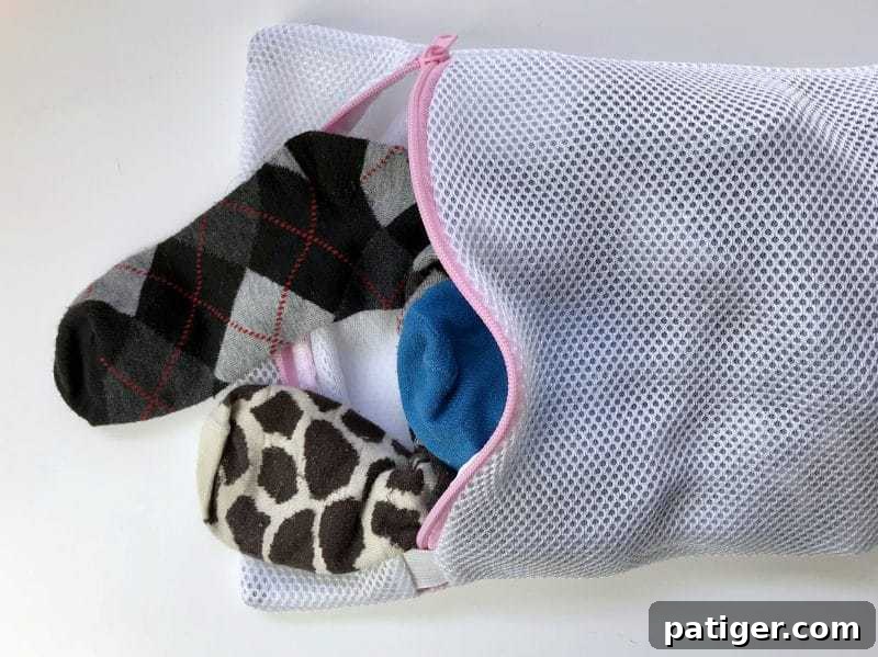 Keep socks from going missing by washing them in a mesh laundry bag, an essential laundry hack for an organized routine.