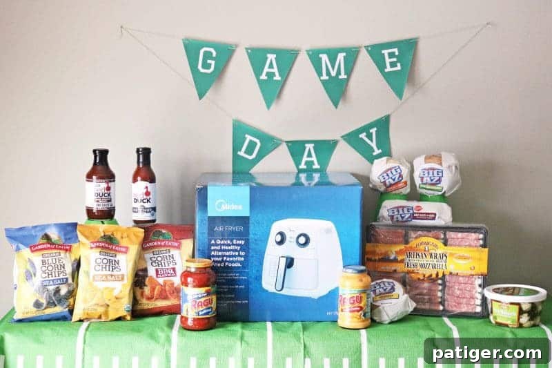 An exciting and easy football themed party spread featuring mini mac & cheese cups, a DIY Game Day banner, toothpick toppers, and printable buffet labels, perfect for the Big Game.