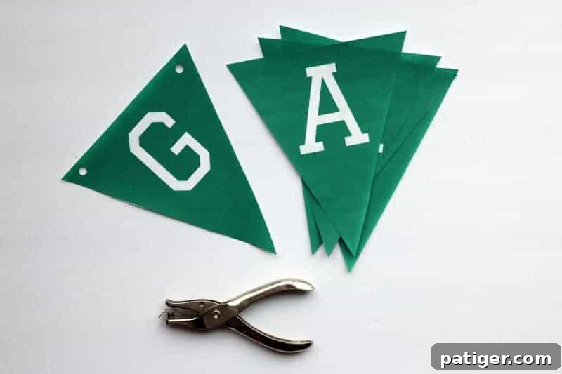 Step-by-step image showing how to cut out the banner triangles for Game Day decor.