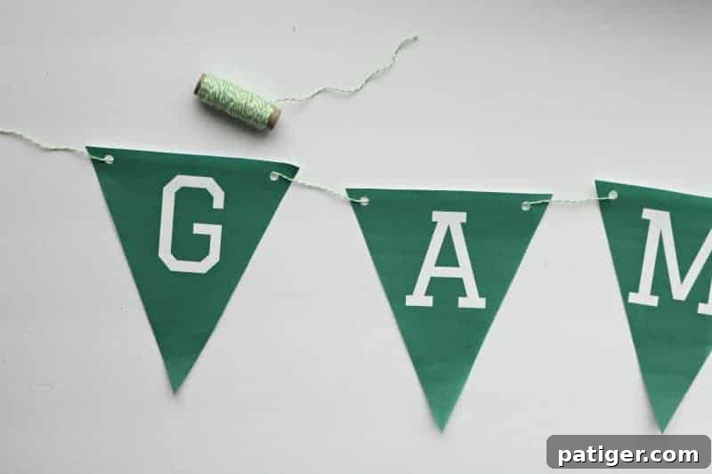 Image demonstrating how to string the banner triangles together with twine.