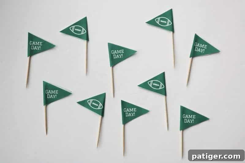 A collection of completed Game Day toothpick toppers, ready for use at a party.