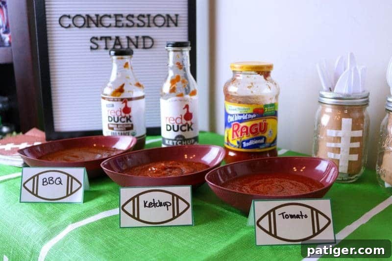 Variety of gourmet dipping sauces, including Smoky Ketchup and Applewood Smoked Molasses BBQ Sauce, for Game Day appetizers.