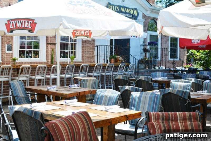 Charming outdoor patio and bar area at Bell's Mansion in Stanhope, a beautifully restored 1800s mansion offering seasonal dining.