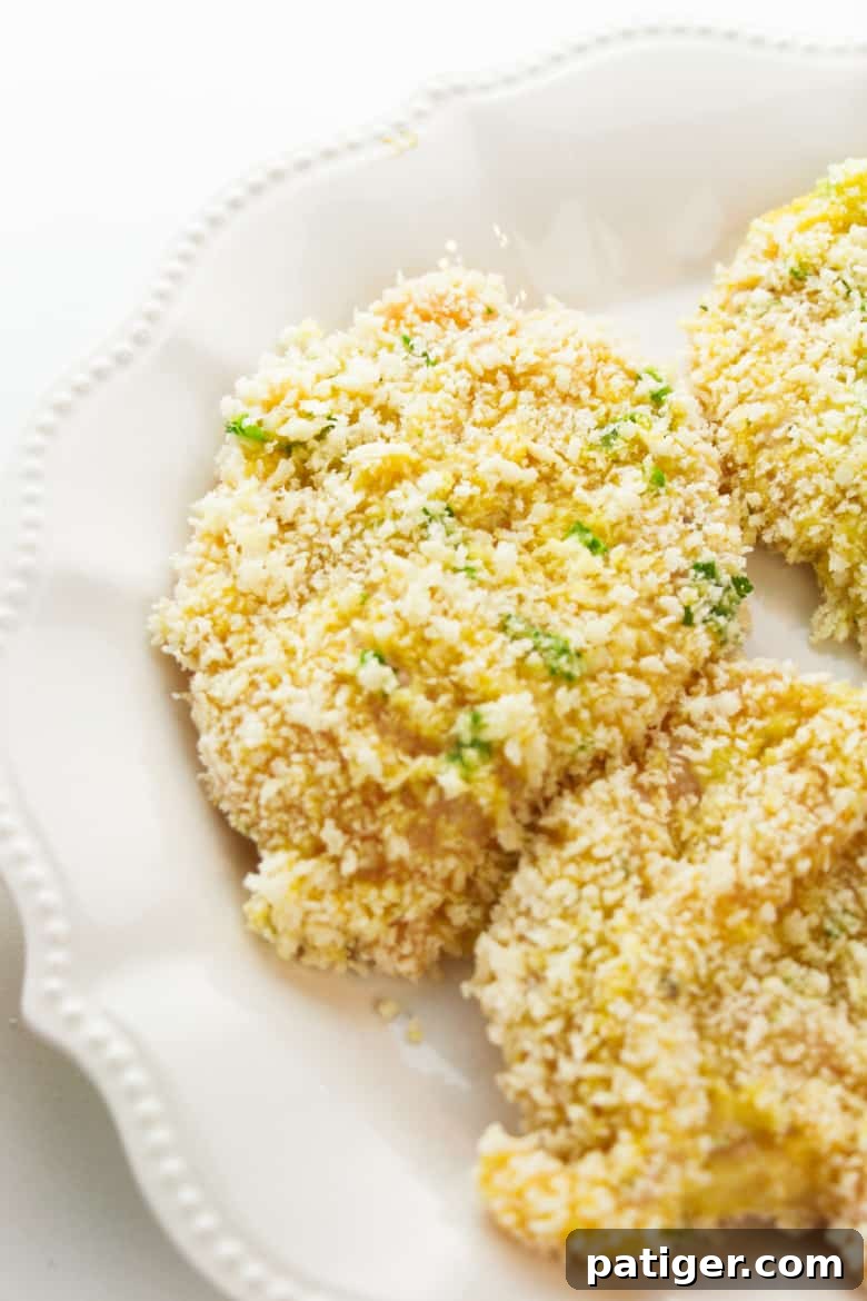 Breaded chicken cutlets ready for pan-frying for homemade chicken parm