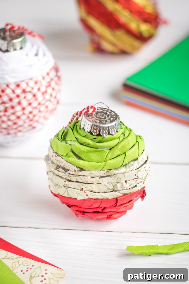 Paper twist Christmas ornaments: A collection of twisted paper ornaments with different designs, ready to be hung on a Christmas tree.