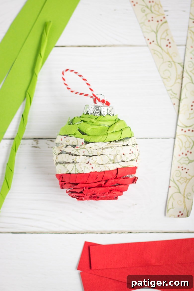 Homemade Twisted Paper Christmas Ornament: A completed ornament, showcasing a beautiful combination of twisted paper patterns and colors.