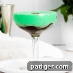 Grasshopper Cocktail layered in glass with chocolate sauce