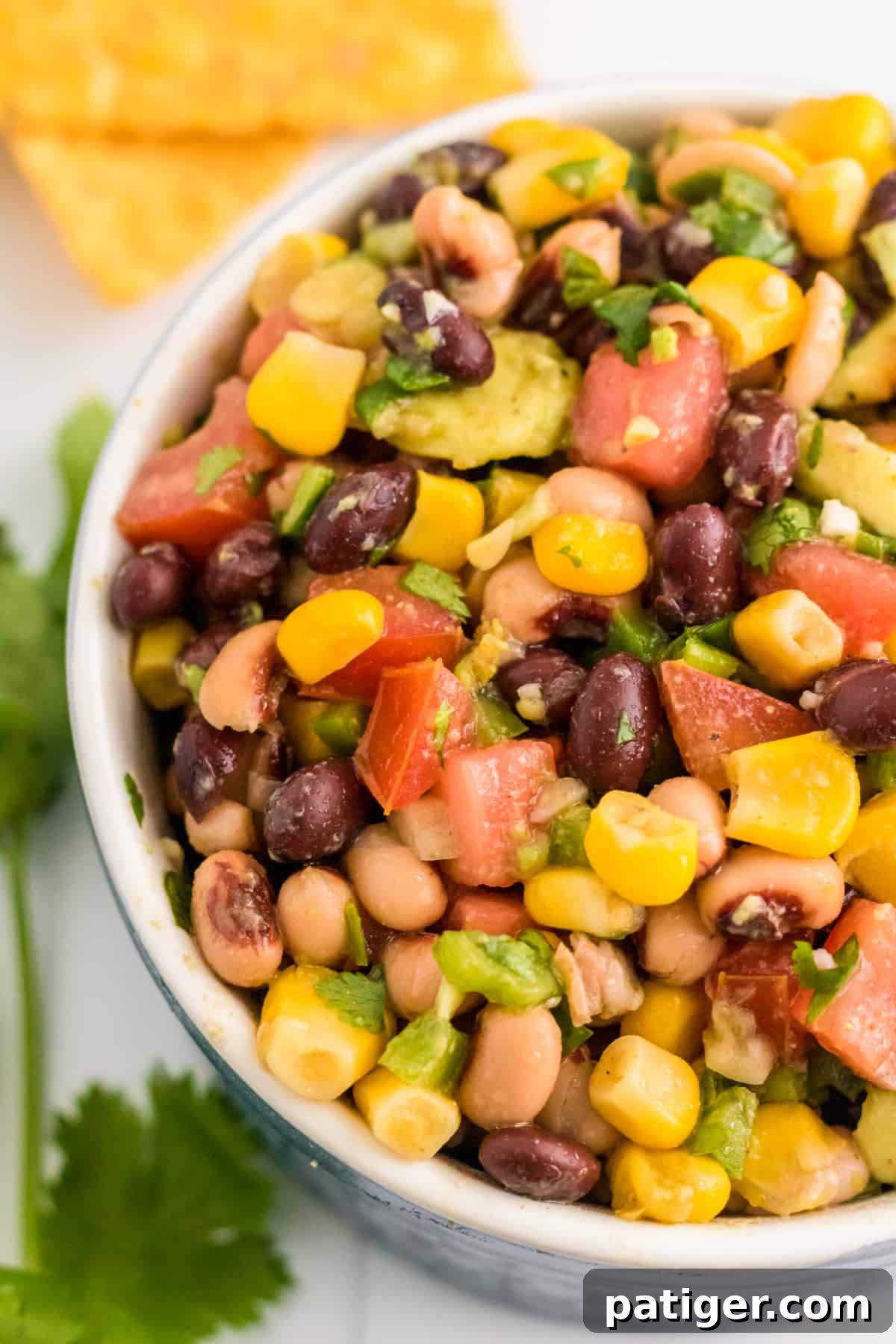 Texas caviar aka cowboy caviar loaded with beans, corn, avocado, and tomatoes