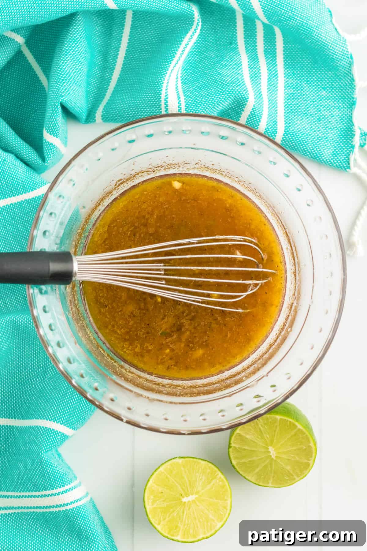 Dressing in glass bowl with whisk