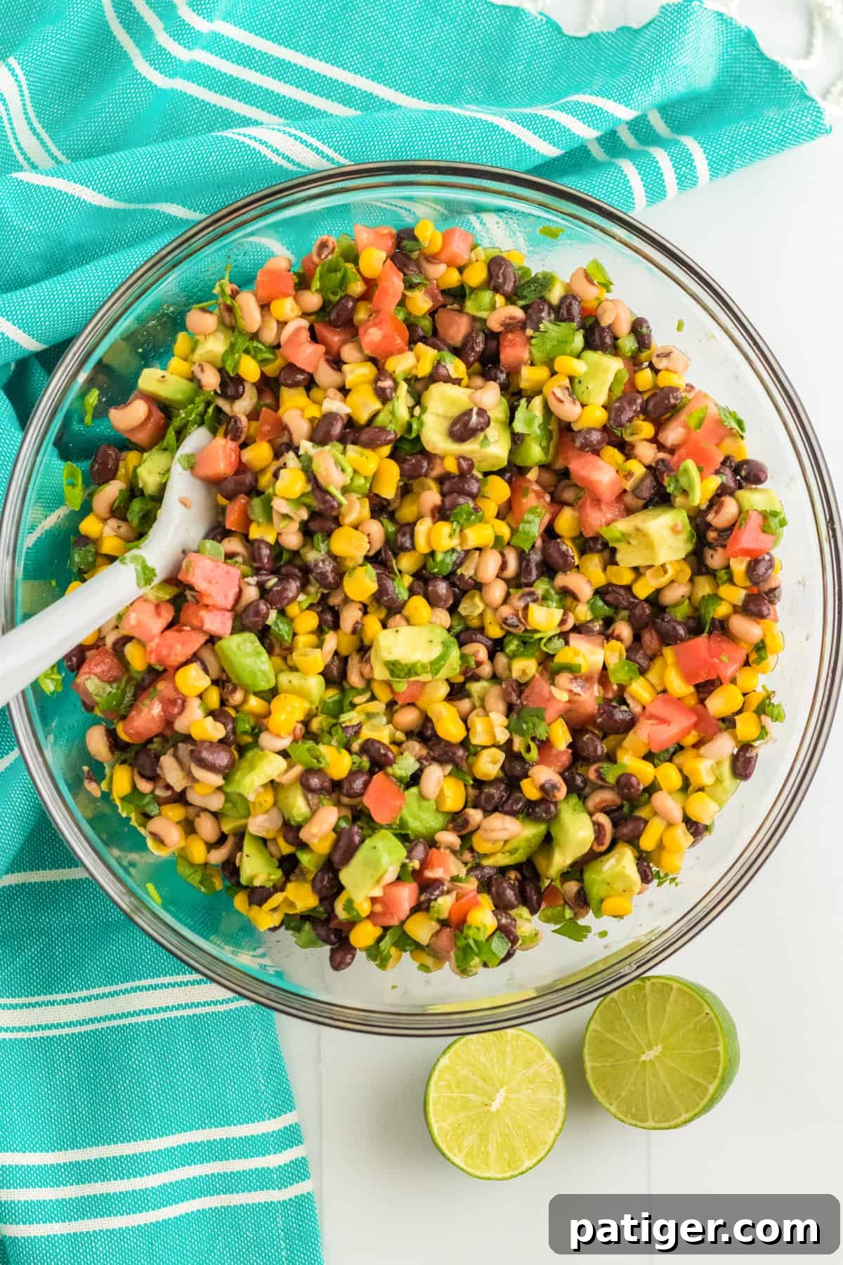 Cowboy caviar in large glass bowl with spoon