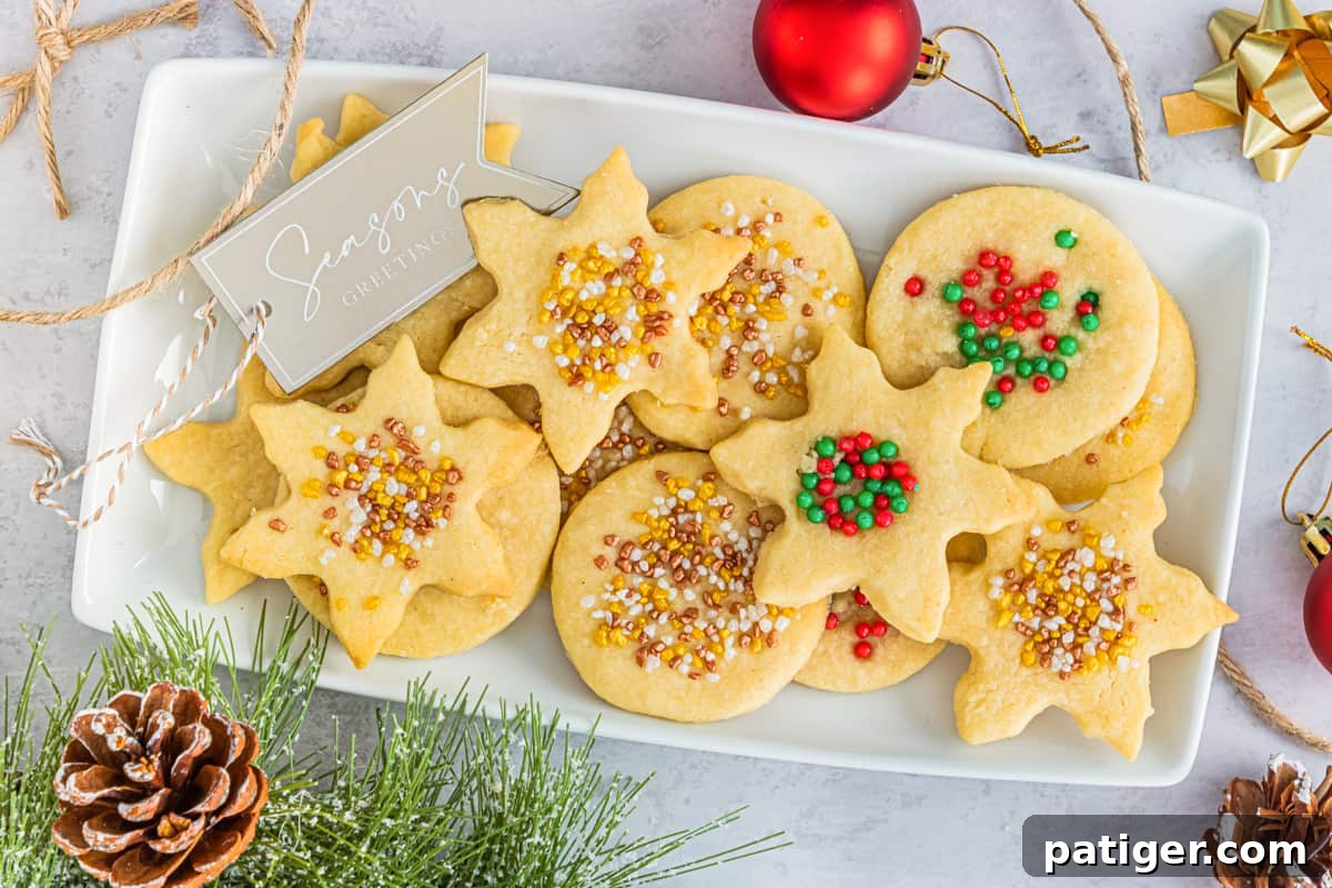 Tray of christmas shortbread cookies with festive sprinkles