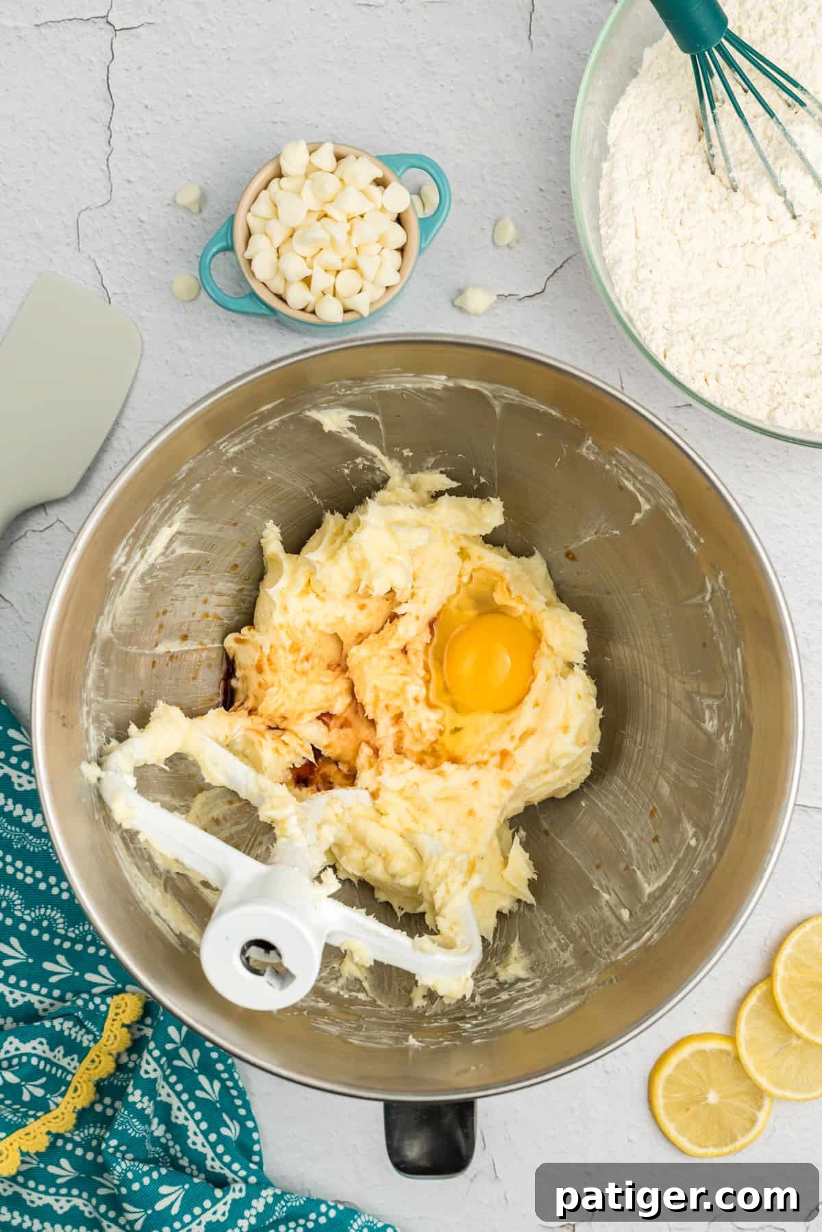 Eggs, lemon zest, and creamed butter and sugar in the bowl of a stand mixer with a paddle attachment.