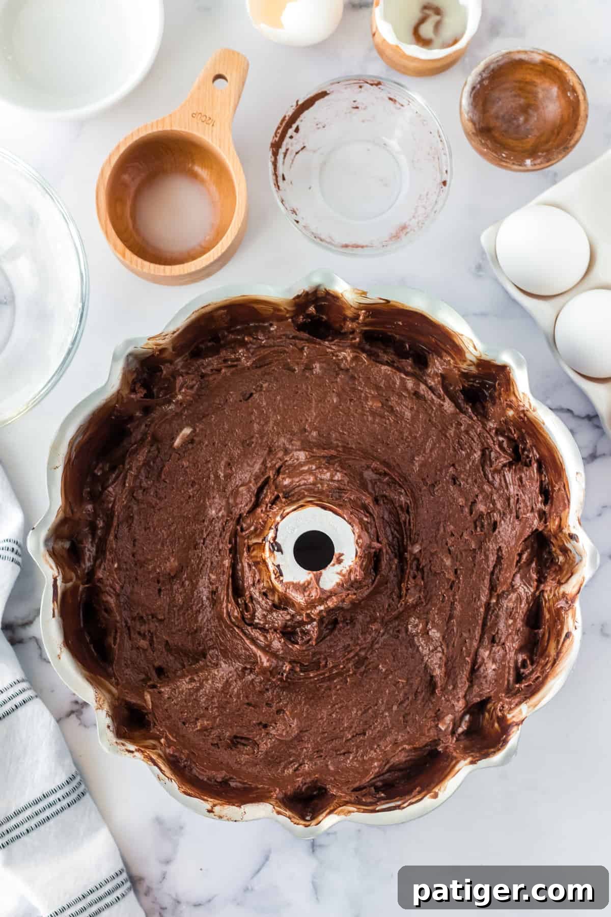 Chocolate coconut cake batter in bundt pan.