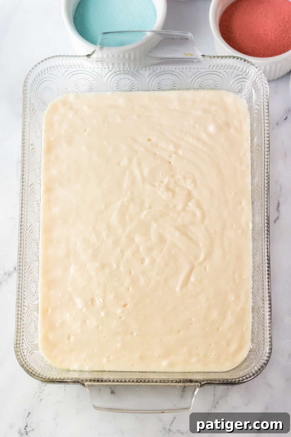 White cake batter in 9 x 13 pan.