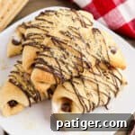 S'mores crescent rolls with marshmallows, melted chocolate, and graham cracker crumbs.