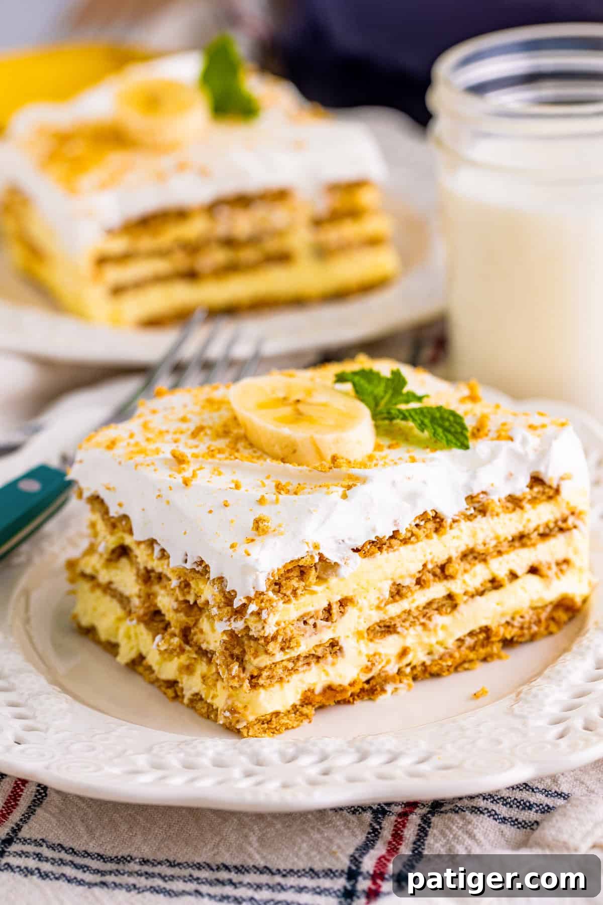 Banana icebox cake with layers of banana pudding, graham crackers, and cool whip.