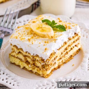 Banana icebox cake with layers of banana pudding, graham crackers, and cool whip.