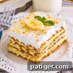 Banana icebox cake with layers of banana pudding, graham crackers, and cool whip.