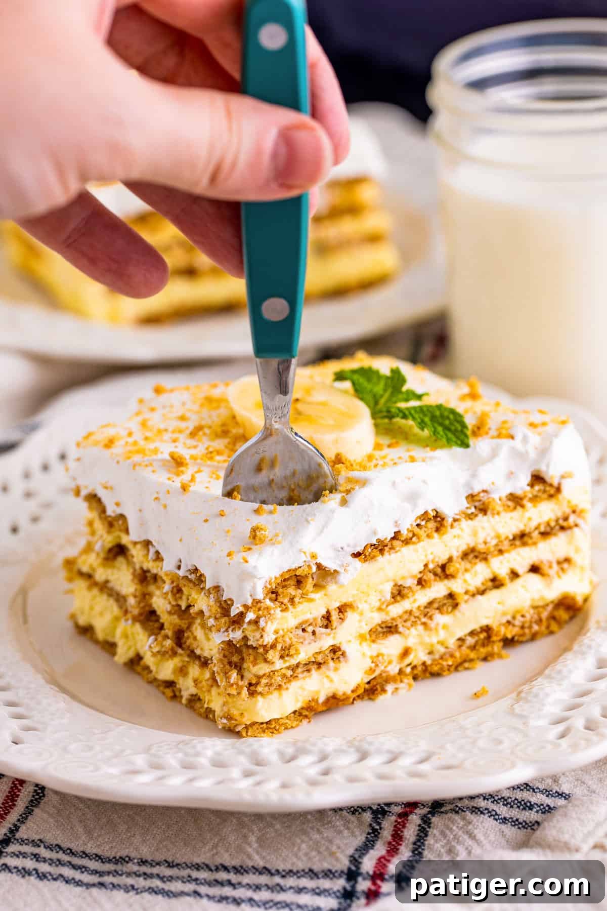 Fork taking a piece of banana icebox cake.