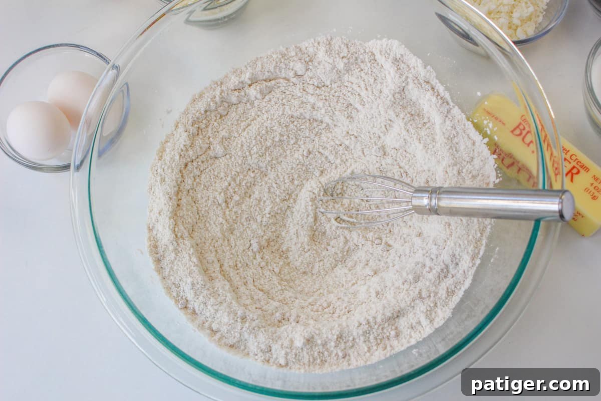Dry ingredients and whisk in glass bowl.