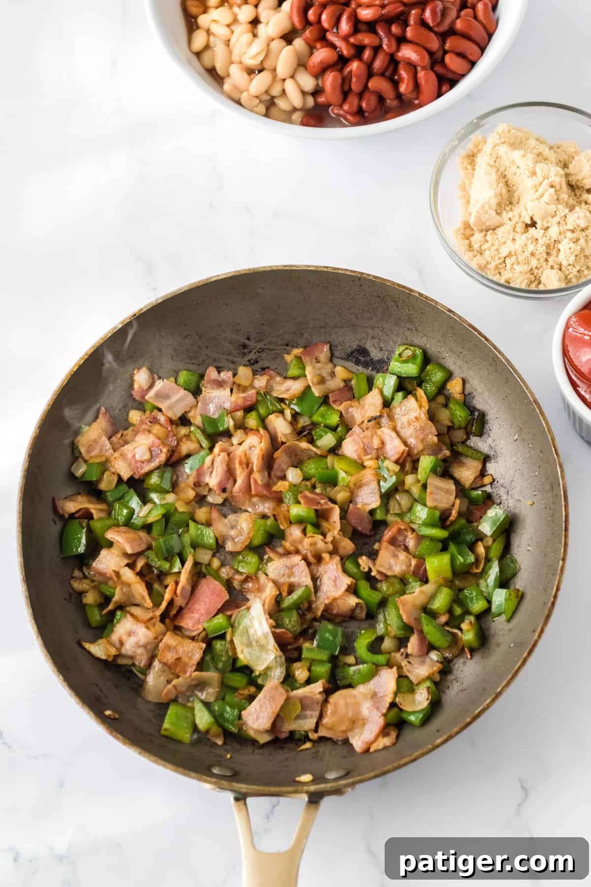 Bacon, green pepper, and onion in large skillet.