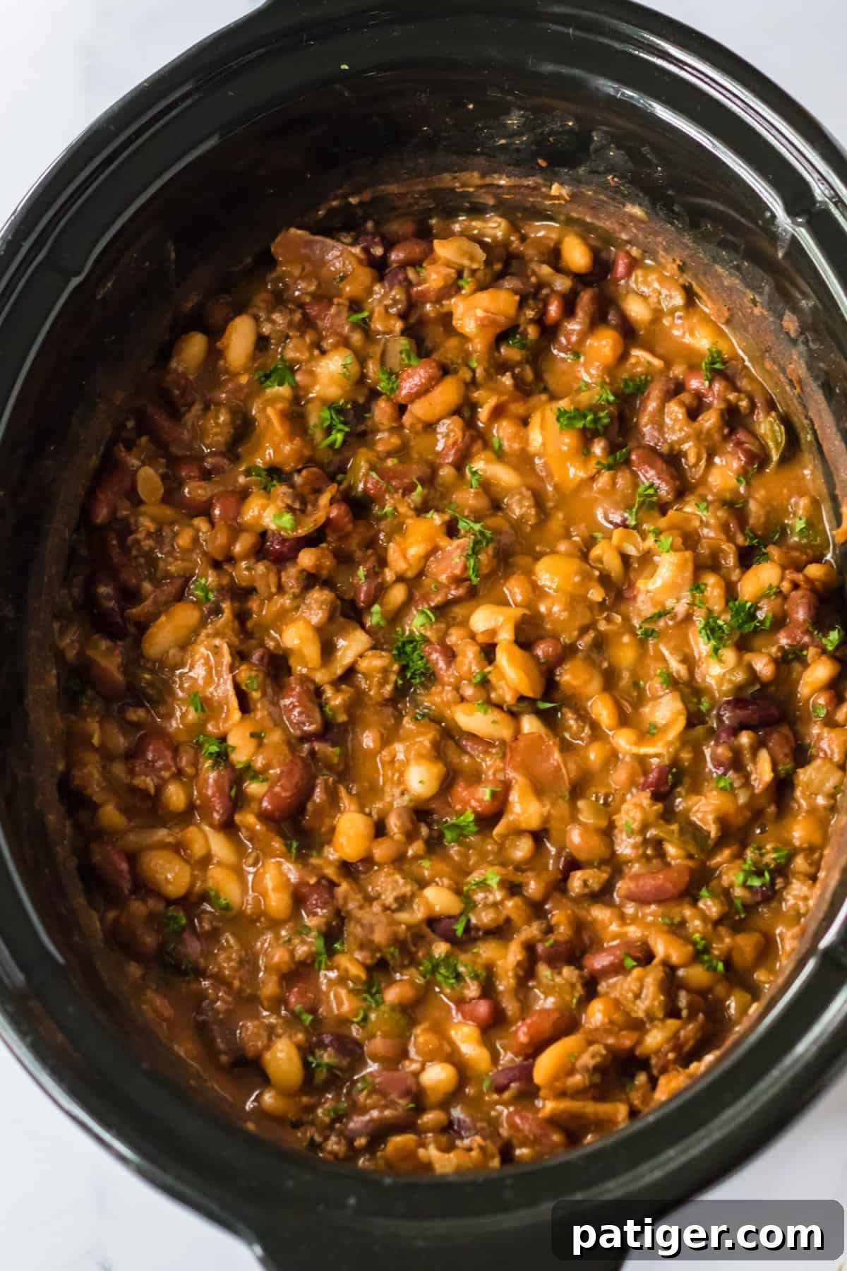 Calico beans in the slow cooker.