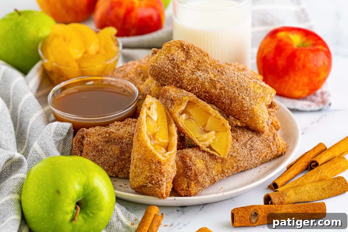 Apple pie egg rolls with apple pie filling and caramel sauce for dipping.