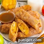 Apple pie egg rolls with apple pie filling and caramel sauce for dipping.