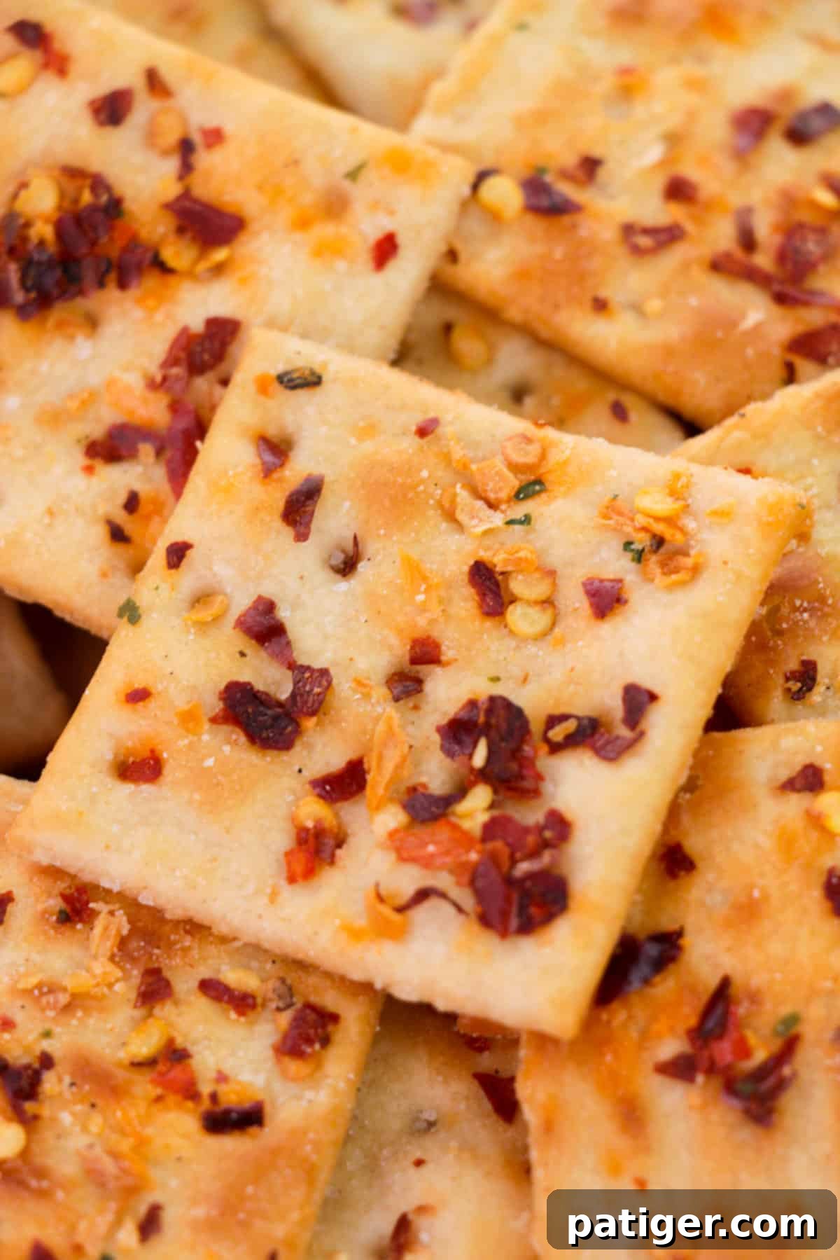 A bowl filled with freshly baked Alabama Fire Crackers, seasoned with spices and ready to eat.