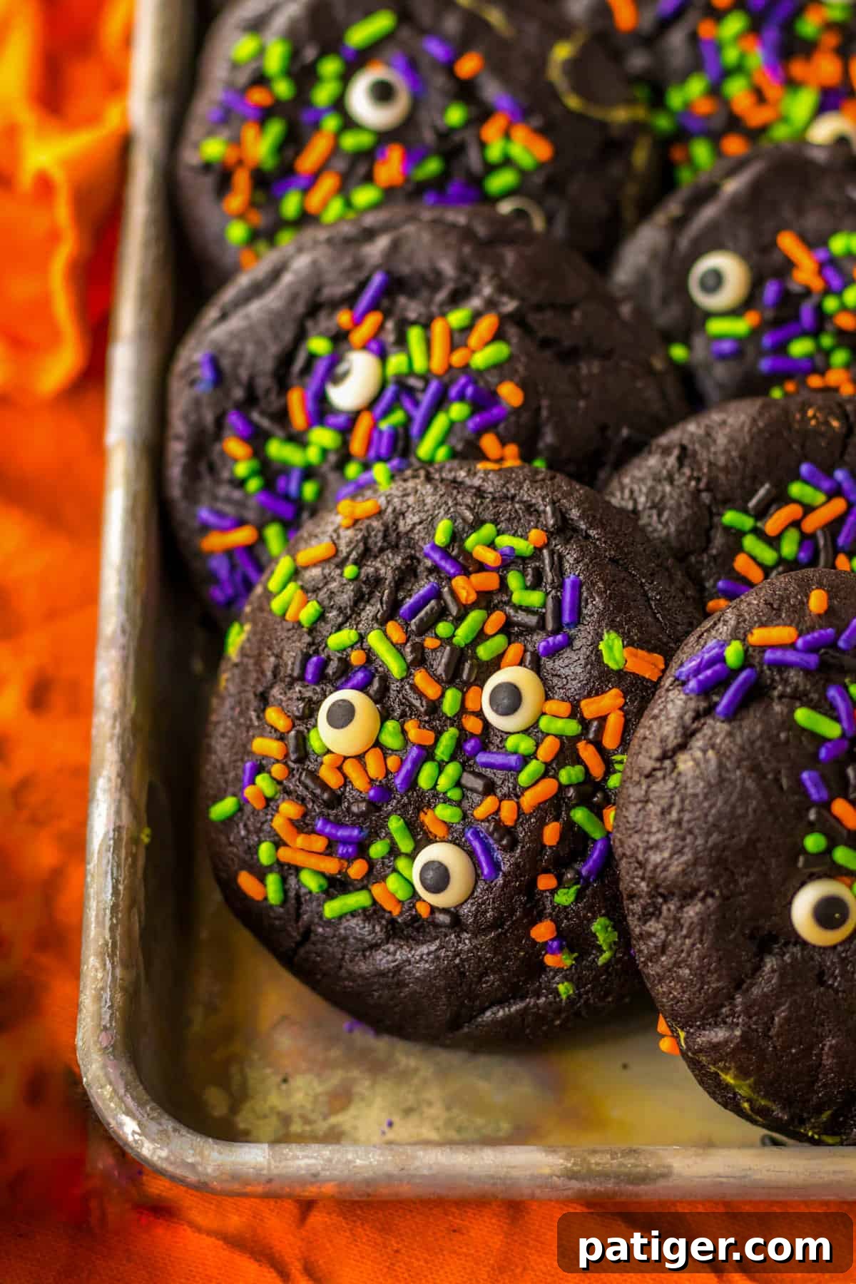 Black Halloween Cookies decorated with sprinkles.