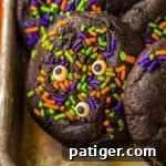 Slime filled black velvet halloween cookies with bright halloween sprinkles and candy eyes.