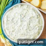 Cold and creamy Knorr spinach dip served with sliced bread pieces for dipping.